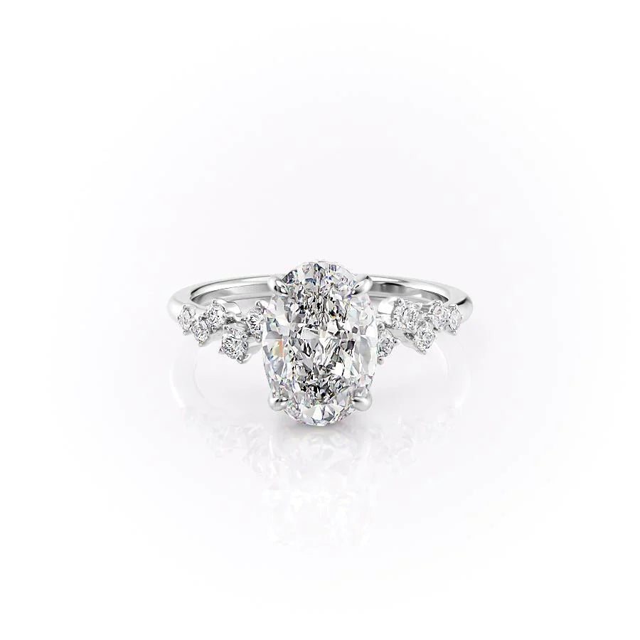 The Mia. A White Gold Side Stones, Hidden Halo Engagement Ring Set With A 2ct Oval Lab Grown Diamond. White Background.
