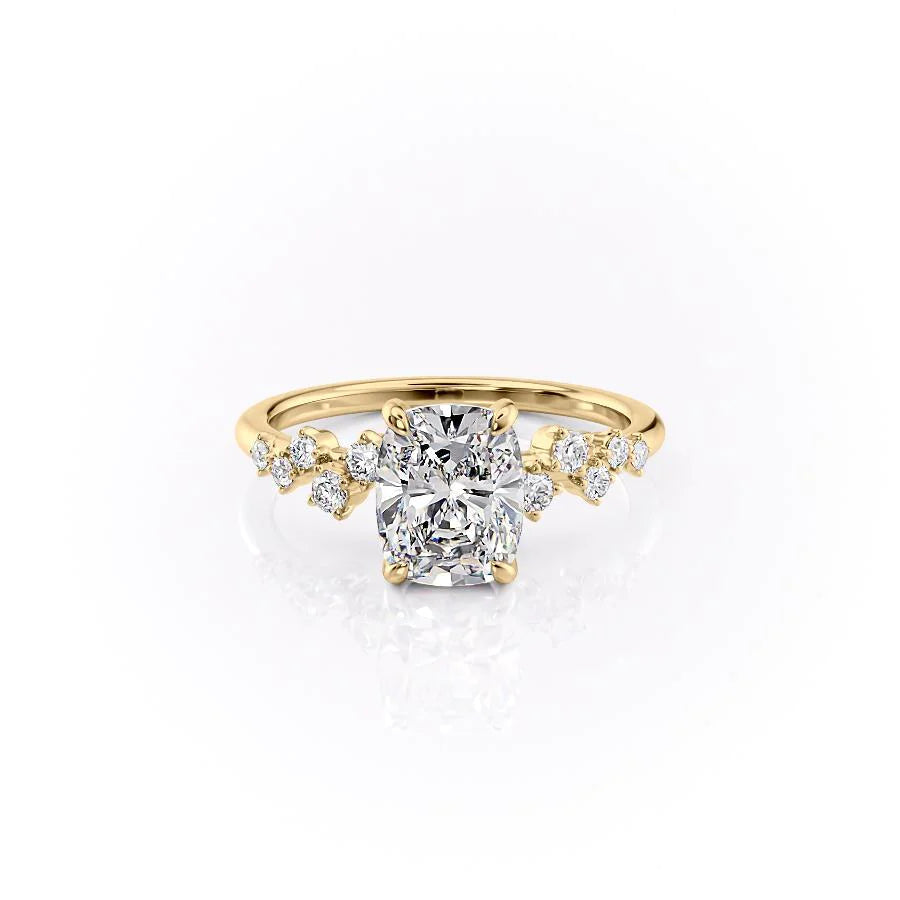 The Mia. A Yellow Gold Side Stones, Hidden Halo Engagement Ring Set With A 2ct Elongated Cushion Lab Grown Diamond. White Background.
