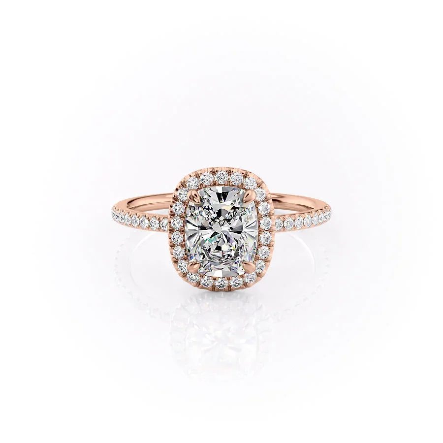 The Michelle. A Rose Gold Halo, Pave Engagement Ring Set With A 2ct Elongated Cushion Lab Grown Diamond. White Background.