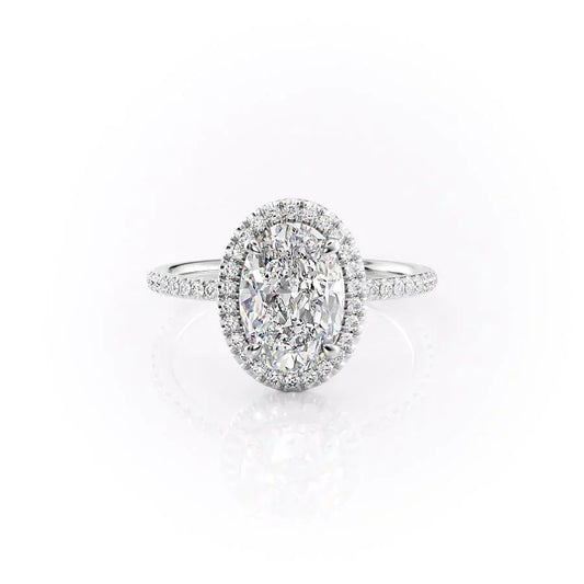 The Michelle. A White Gold Halo, Pave Engagement Ring Set With A 2ct Oval Lab Grown Diamond. White Background.
