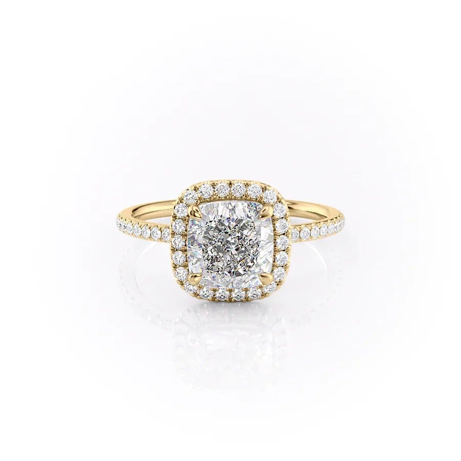 The Michelle. A Yellow Gold Halo, Pave Engagement Ring Set With A 2ct Cushion Lab Grown Diamond. White Background.