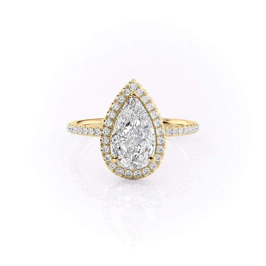 The Michelle. A Yellow Gold Halo, Pave Engagement Ring Set With A 2ct Pear Lab Grown Diamond. White Background.