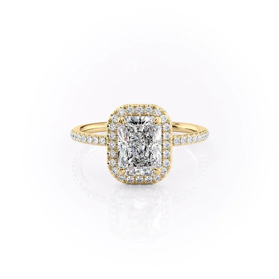 The Michelle. A Yellow Gold Halo, Pave Engagement Ring Set With A 2ct Radiant Lab Grown Diamond. White Background.