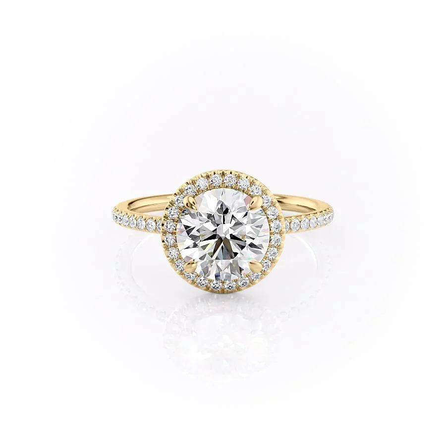The Michelle. A Yellow Gold Halo, Pave Engagement Ring Set With A 2ct Round Lab Grown Diamond. White Background.