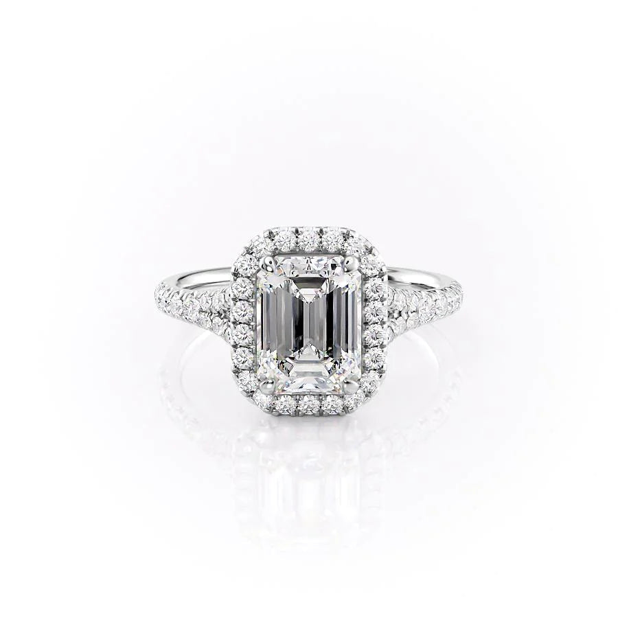 The Miley. A White Gold Halo, Pave Engagement Ring Set With A 2ct Emerald Lab Grown Diamond. White Background.