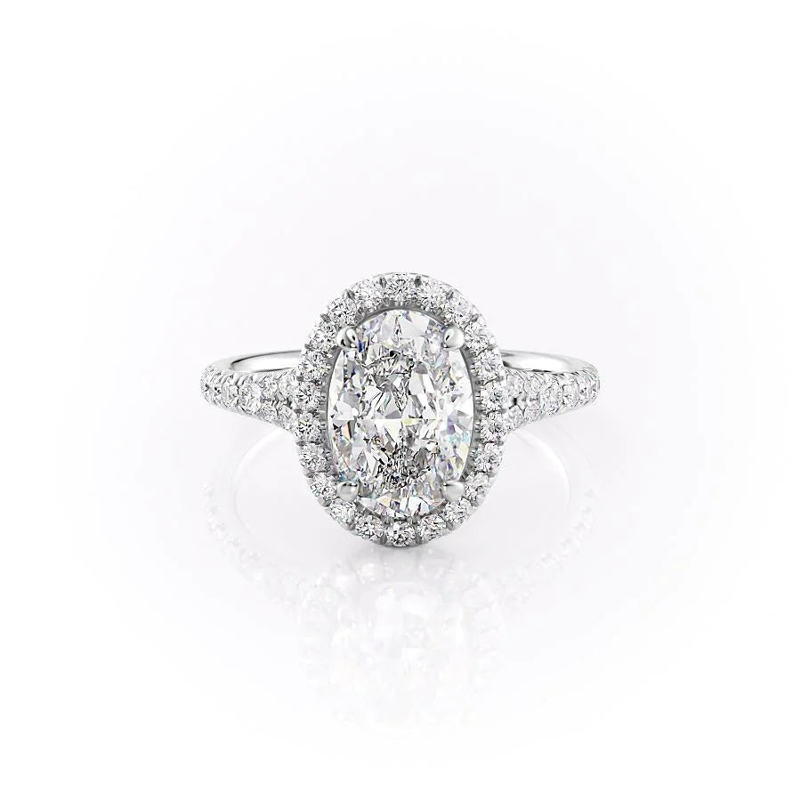 The Miley. A White Gold Halo, Pave Engagement Ring Set With A 2ct Oval Lab Grown Diamond. White Background.