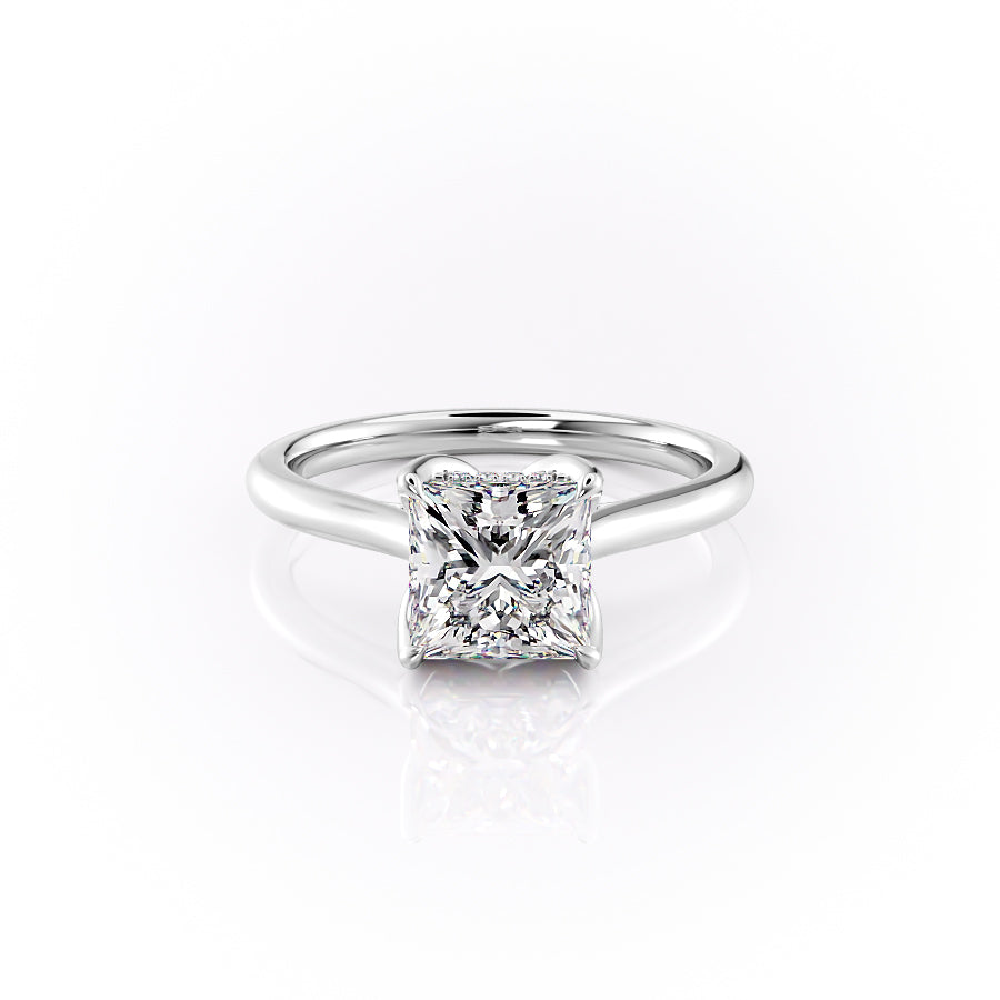 The Morgan. A White Gold Hidden Halo, Solitaire, Nature Engagement Ring Set With A 2ct Princess Lab Grown Diamond. White Background.