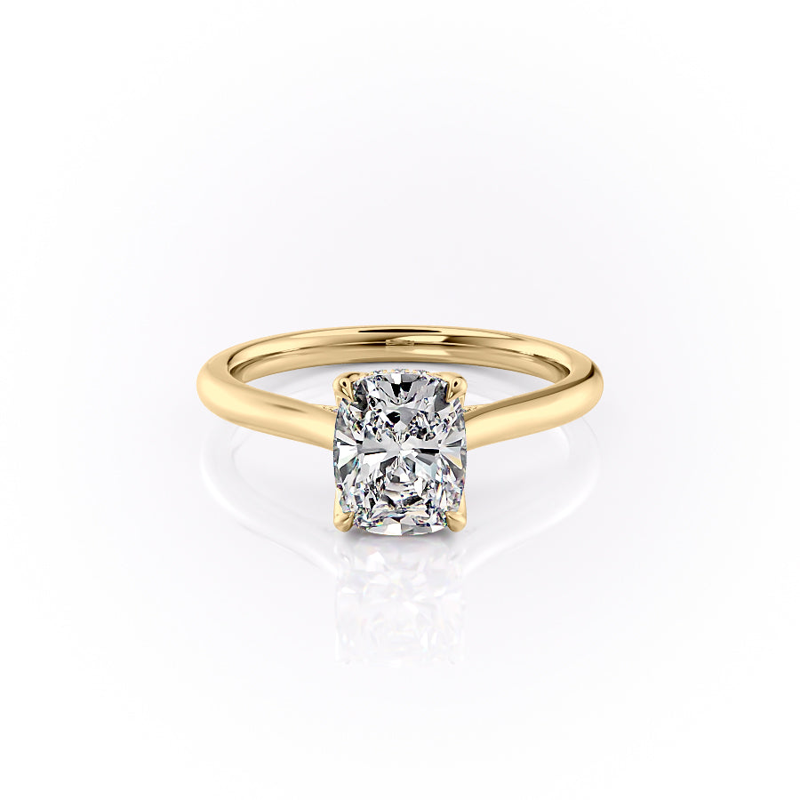 The Morgan. A Yellow Gold Hidden Halo, Solitaire, Nature Engagement Ring Set With A 2ct Elongated Cushion Lab Grown Diamond. White Background.