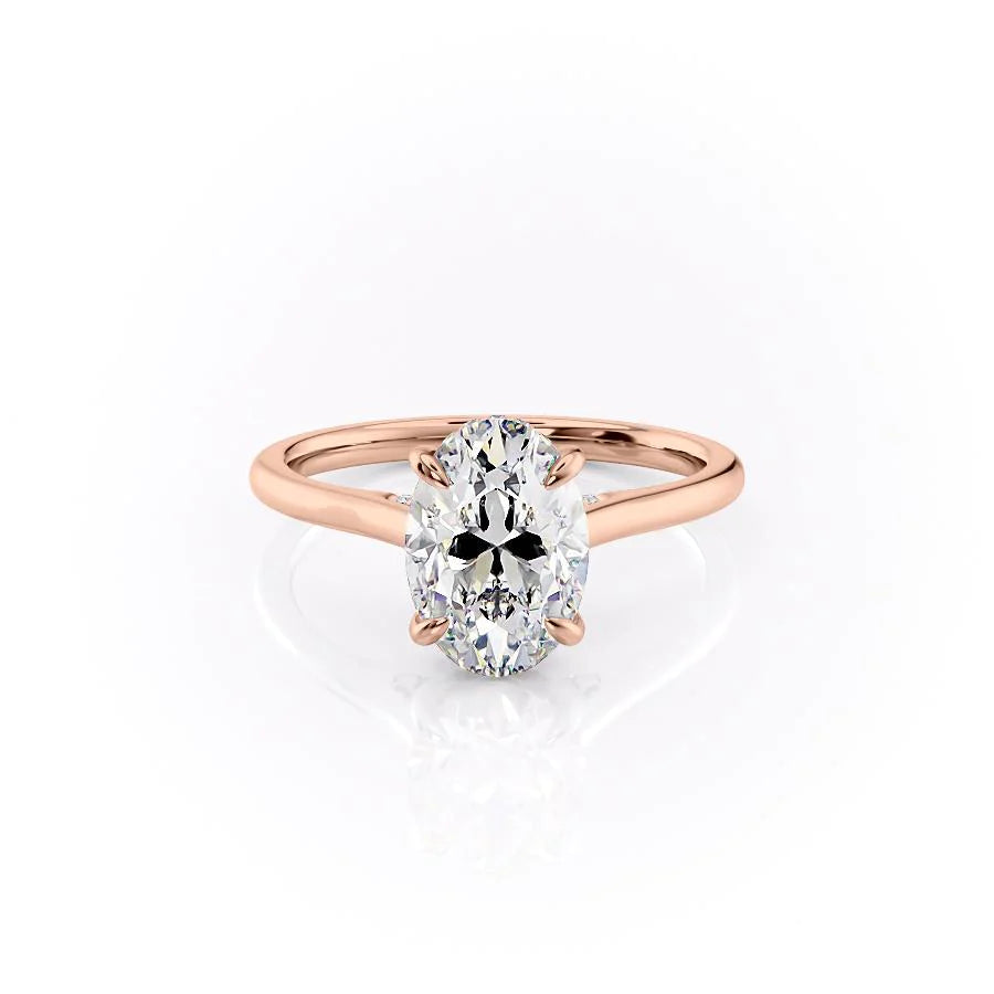 The Natalie. A Rose Gold Solitaire, Hidden Halo Engagement Ring Set With A 2ct Oval Lab Grown Diamond. White Background.