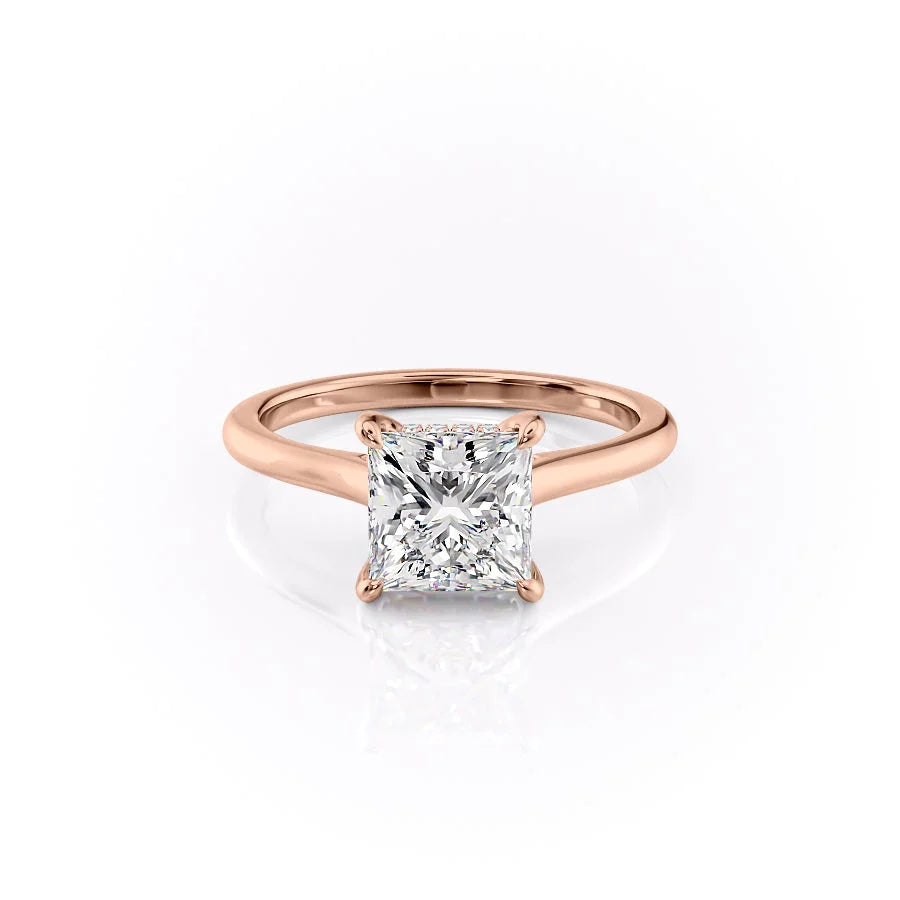 The Natalie. A Rose Gold Solitaire, Hidden Halo Engagement Ring Set With A 2ct Princess Lab Grown Diamond. White Background.