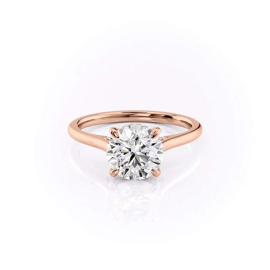 The Natalie. A Rose Gold Solitaire, Hidden Halo Engagement Ring Set With A 2ct Round Lab Grown Diamond. White Background.
