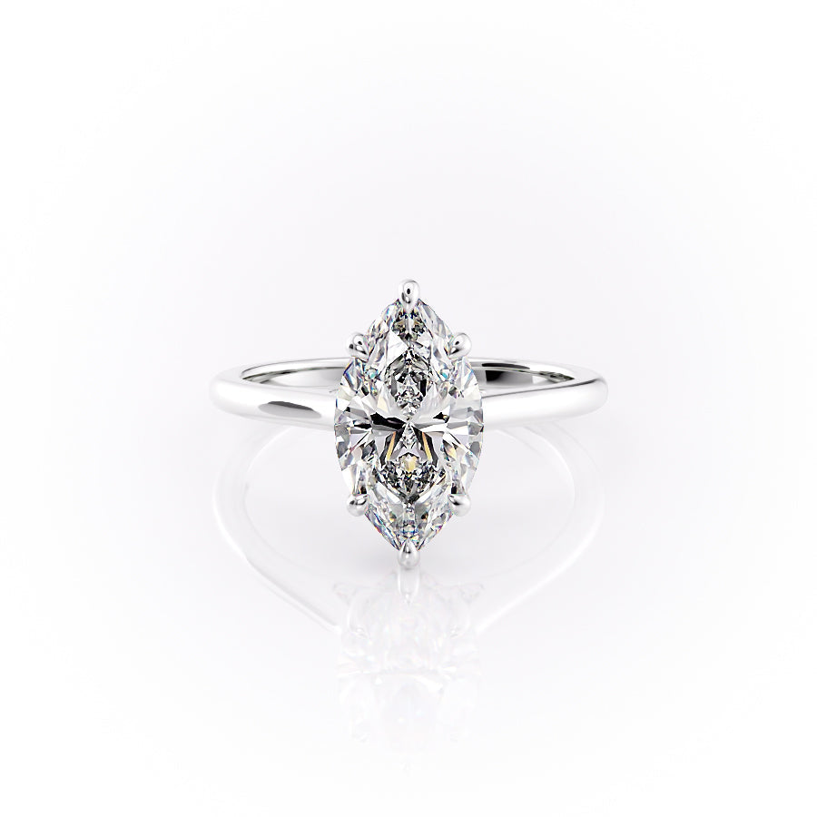 The Natalie. A White Gold Solitaire, Hidden Halo Engagement Ring Set With A 2ct Marquise Lab Grown Diamond. White Background.