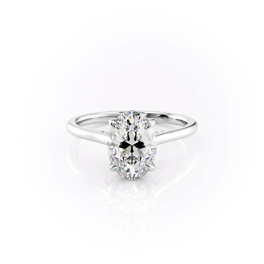 The Natalie. A White Gold Solitaire, Hidden Halo Engagement Ring Set With A 2ct Oval Lab Grown Diamond. White Background.