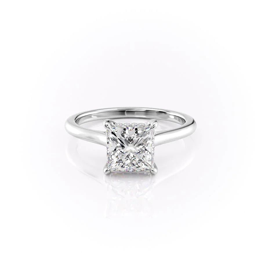 The Natalie. A White Gold Solitaire, Hidden Halo Engagement Ring Set With A 2ct Princess Lab Grown Diamond. White Background.