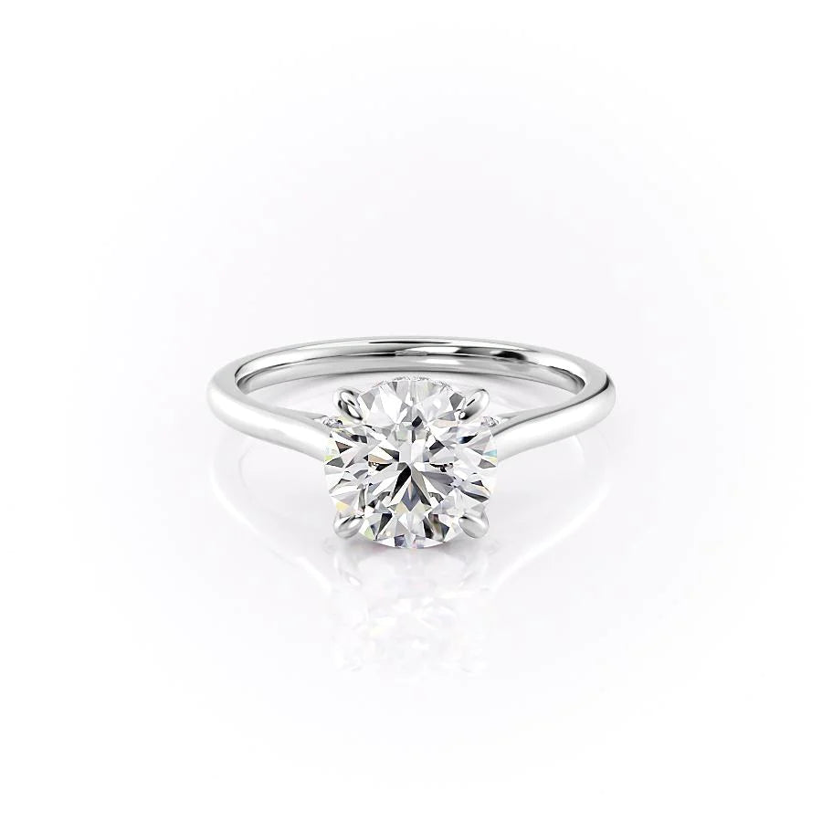 The Natalie. A White Gold Solitaire, Hidden Halo Engagement Ring Set With A 2ct Round Lab Grown Diamond. White Background.