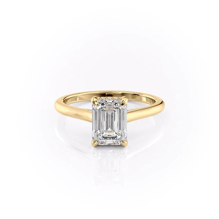 The Natalie. A Yellow Gold Solitaire, Hidden Halo Engagement Ring Set With A 2ct Emerald Lab Grown Diamond. White Background.