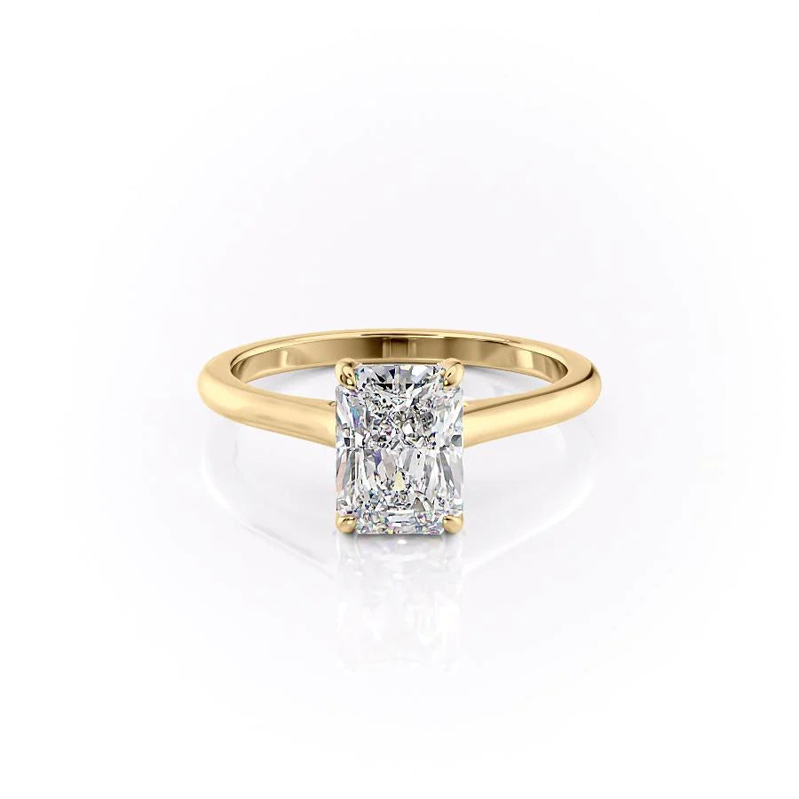 The Natalie. A Yellow Gold Solitaire, Hidden Halo Engagement Ring Set With A 2ct Radiant Lab Grown Diamond. White Background.