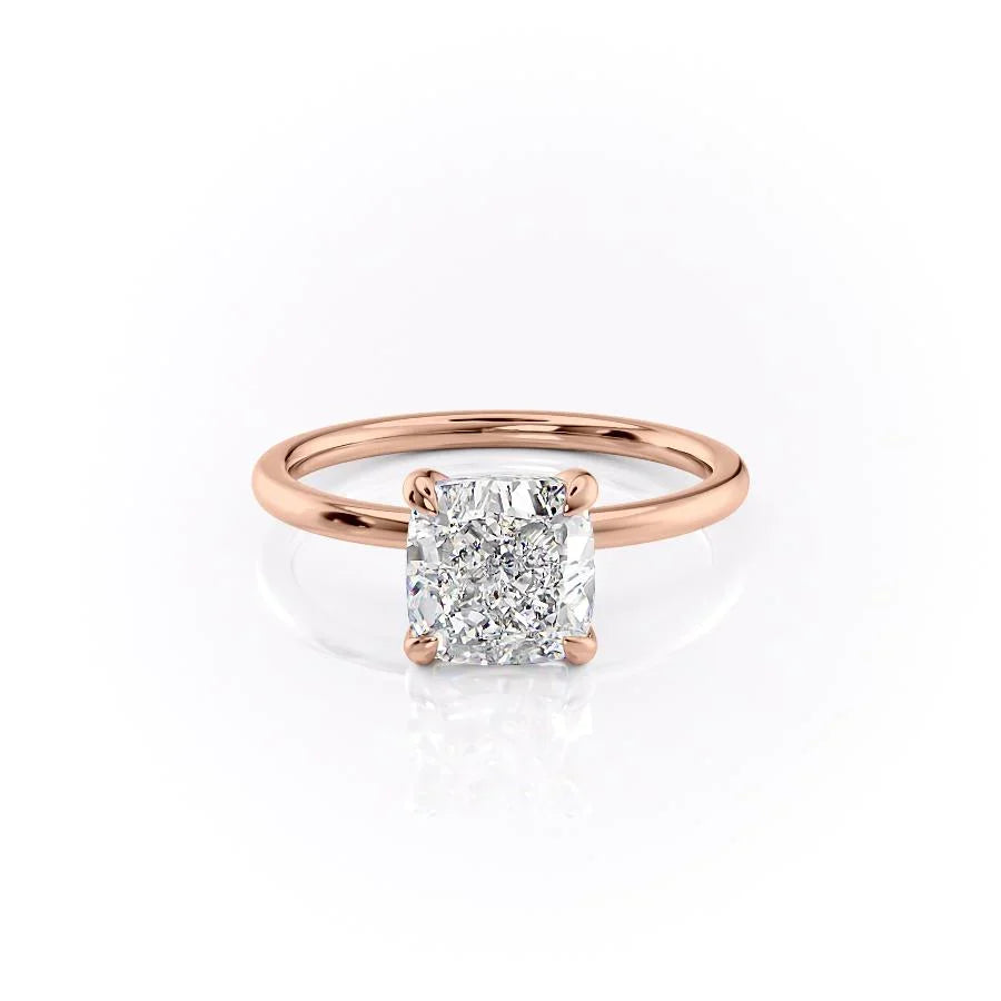 The Nelly. A Rose Gold Solitaire, Hidden Halo Engagement Ring Set With A 2ct Cushion Lab Grown Diamond. White Background.