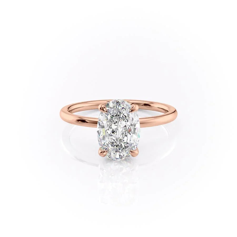 The Nelly. A Rose Gold Solitaire, Hidden Halo Engagement Ring Set With A 2ct Oval Lab Grown Diamond. White Background.