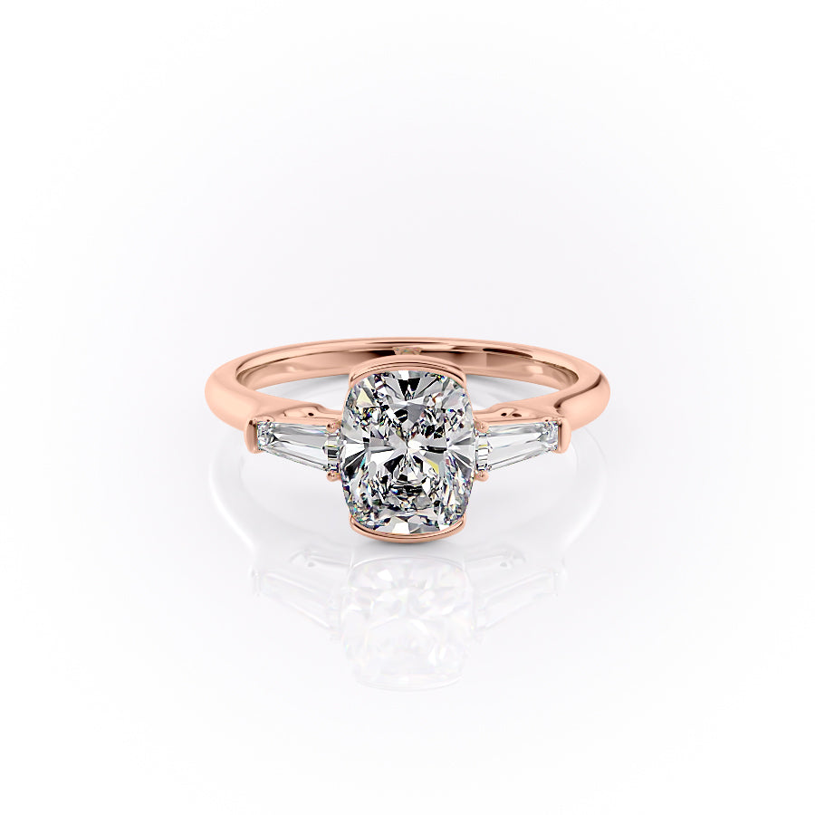 The Parker. A Rose Gold Three Stone, Bezel Engagement Ring Set With A 2ct Elongated Cushion Lab Grown Diamond. White Background.