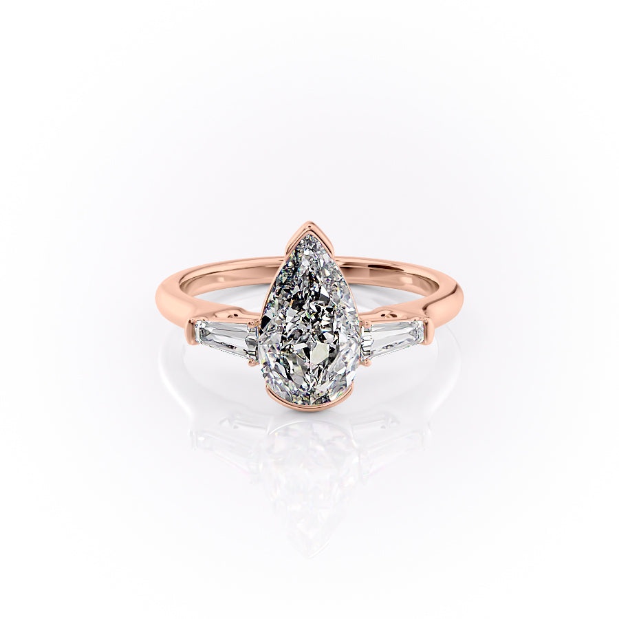 The Parker. A Rose Gold Three Stone, Bezel Engagement Ring Set With A 2ct Pear Lab Grown Diamond. White Background.