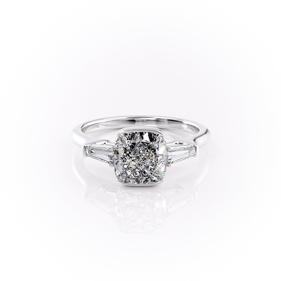 The Parker. A White Gold Three Stone, Bezel Engagement Ring Set With A 2ct Cushion Lab Grown Diamond. White Background.