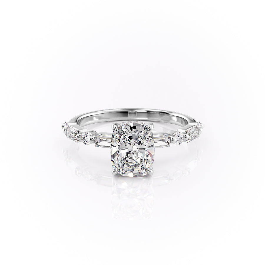 The Patricia. A White Gold Side Stones, Hidden Halo Engagement Ring Set With A 2ct Elongated Cushion Lab Grown Diamond. White Background.