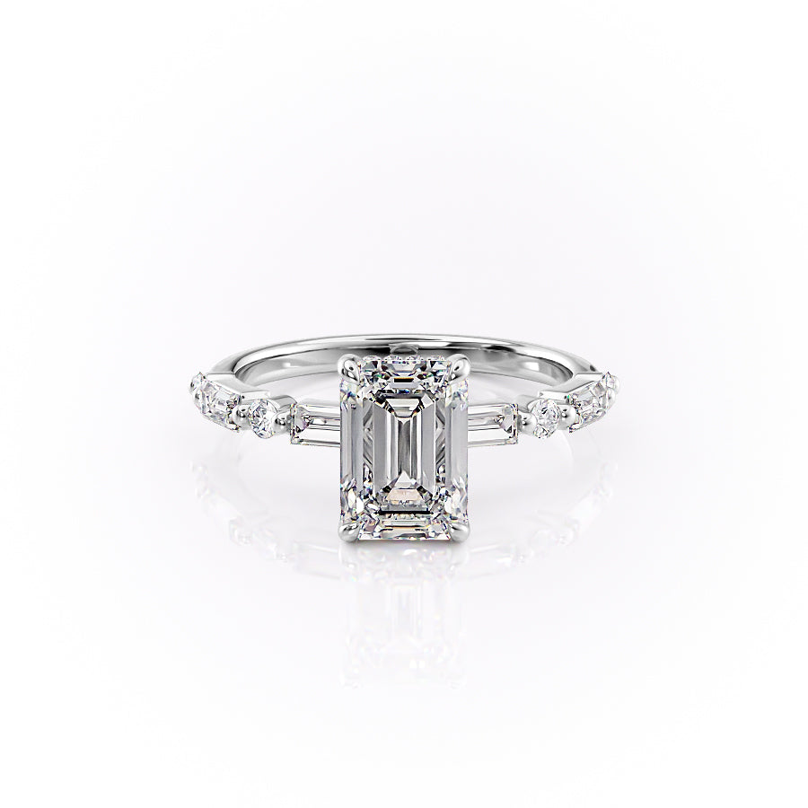 The Patricia. A White Gold Side Stones, Hidden Halo Engagement Ring Set With A 2ct Emerald Lab Grown Diamond. White Background.