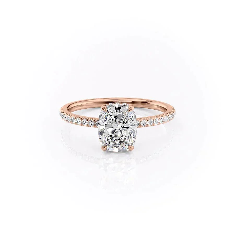 The Pave Aline. A Rose Gold Hidden Halo Engagement Ring Set With A 2ct Elongated Cushion Lab Grown Diamond. White Background.