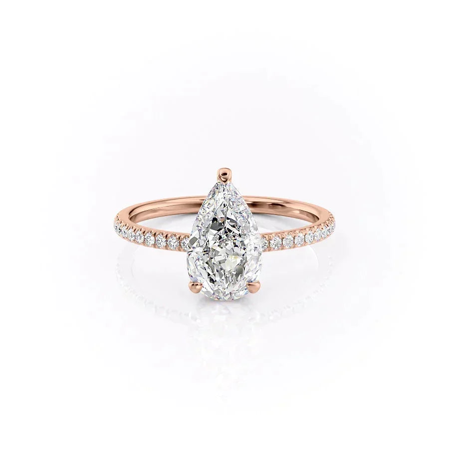The Pave Aline. A Rose Gold Hidden Halo Engagement Ring Set With A 2ct Pear Lab Grown Diamond. White Background.