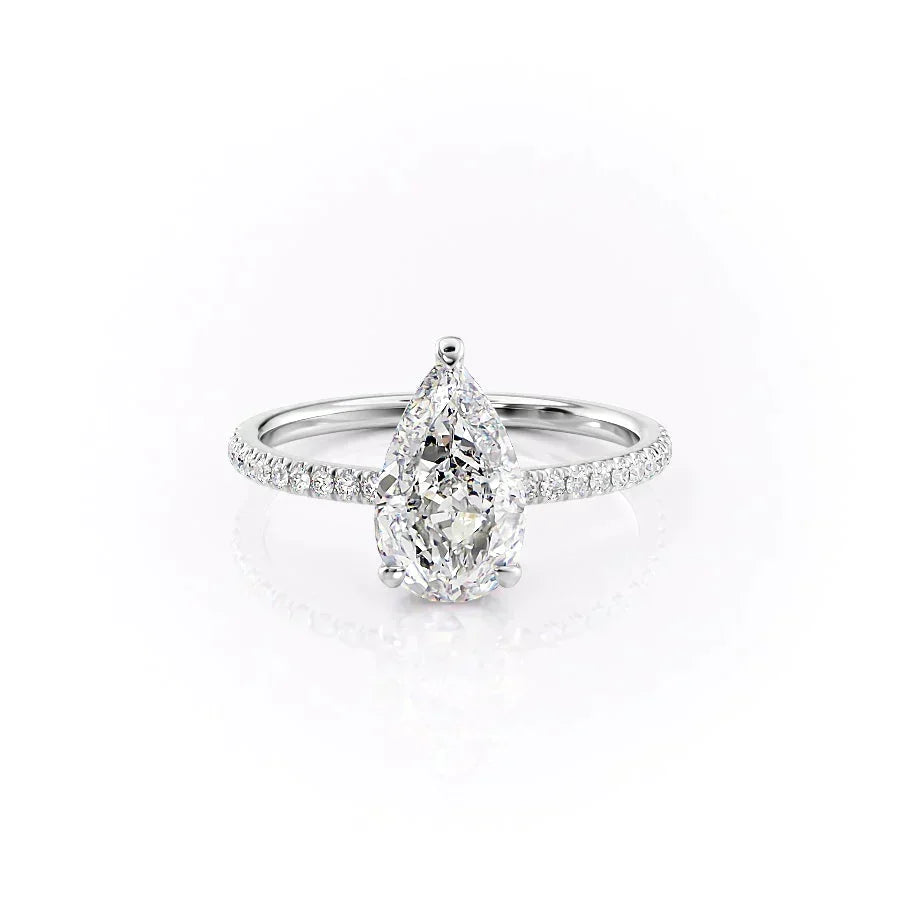 The Pave Aline. A White Gold Hidden Halo Engagement Ring Set With A 2ct Pear Lab Grown Diamond. White Background.