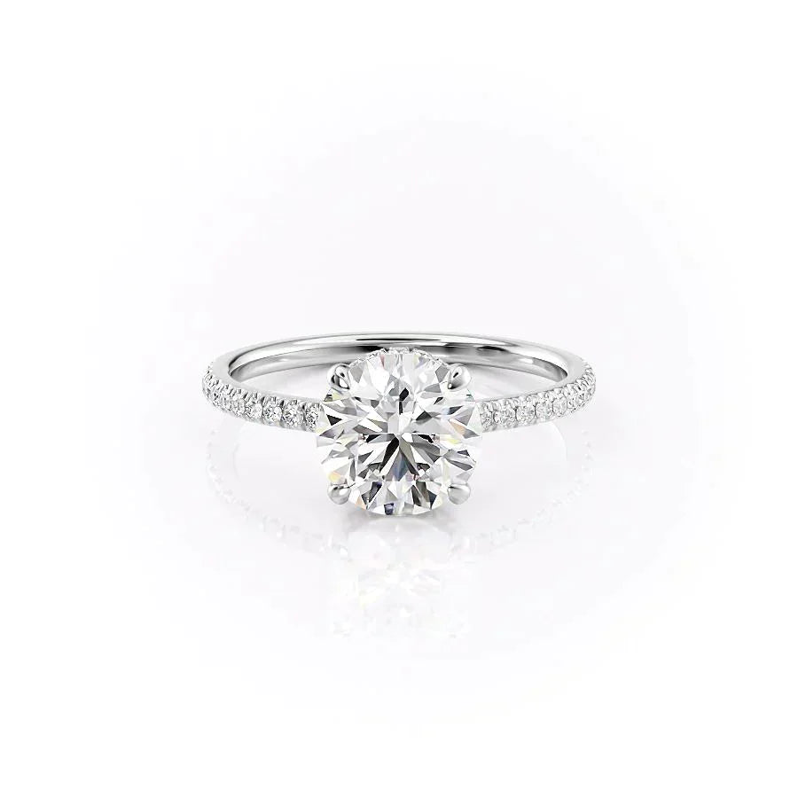 The Pave Aline. A White Gold Hidden Halo Engagement Ring Set With A 2ct Round Lab Grown Diamond. White Background.