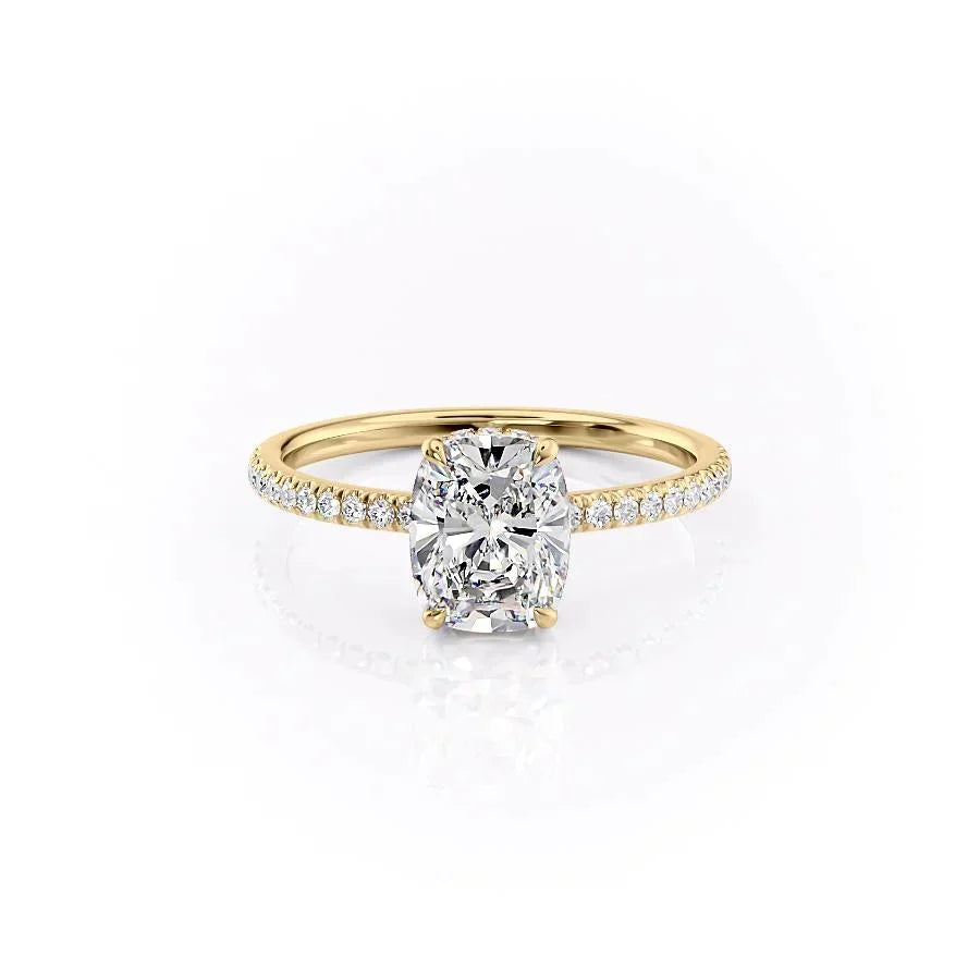 The Pave Aline. A Yellow Gold Hidden Halo Engagement Ring Set With A 2ct Elongated Cushion Lab Grown Diamond. White Background.