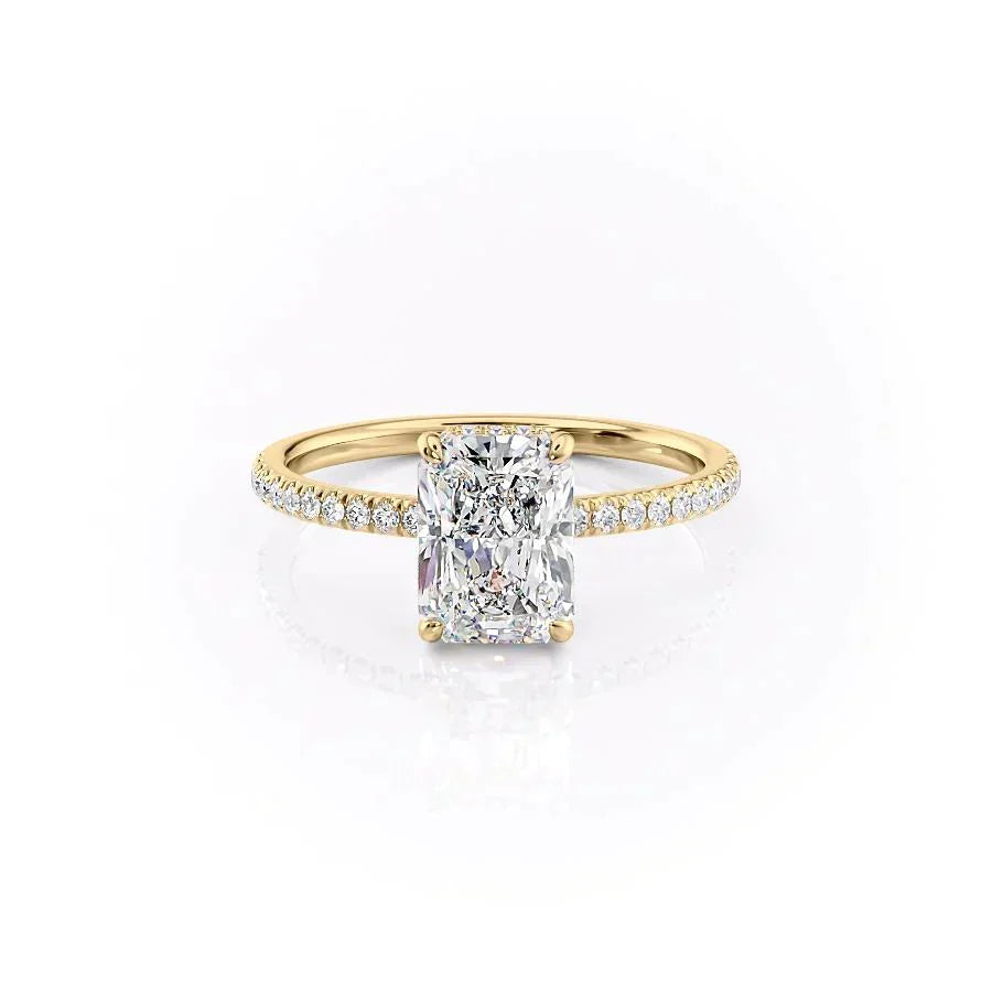 The Pave Aline. A Yellow Gold Hidden Halo Engagement Ring Set With A 2ct Radiant Lab Grown Diamond. White Background.