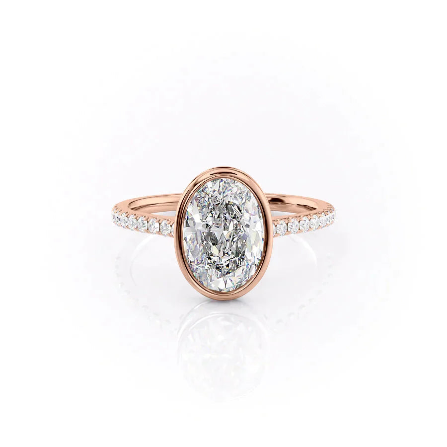 The Pave Charlotte. A Rose Gold Vintage, Hidden Halo, Bezel Engagement Ring Set With A 2ct Oval Lab Grown Diamond. White Background.