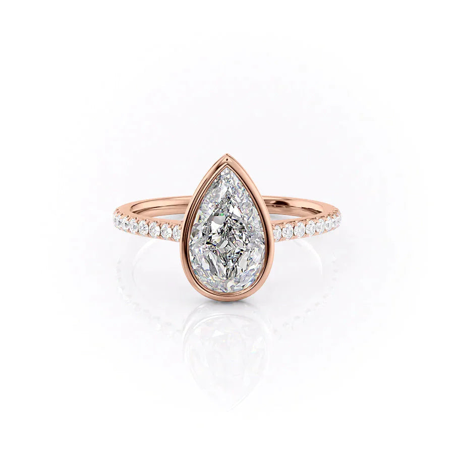 The Pave Charlotte. A Rose Gold Vintage, Hidden Halo, Bezel Engagement Ring Set With A 2ct Pear Lab Grown Diamond. White Background.