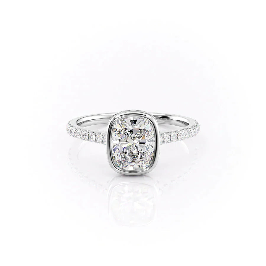 The Pave Charlotte. A White Gold Vintage, Hidden Halo, Bezel Engagement Ring Set With A 2ct Elongated Cushion Lab Grown Diamond. White Background.