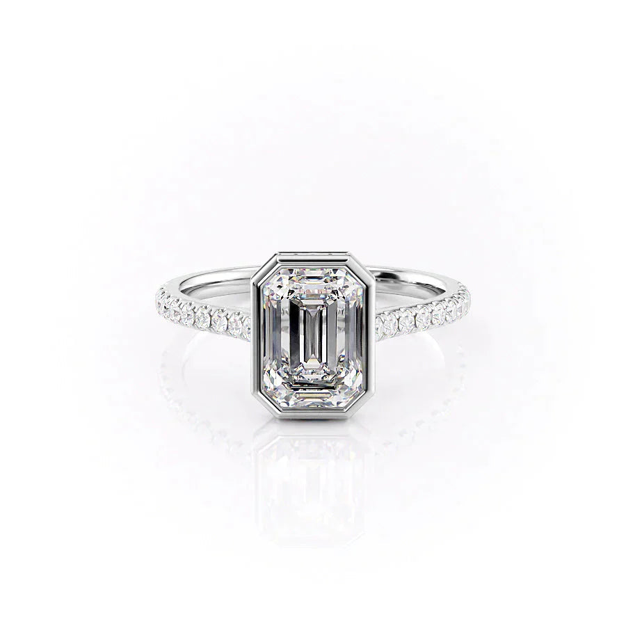 The Pave Charlotte. A White Gold Vintage, Hidden Halo, Bezel Engagement Ring Set With A 2ct Emerald Lab Grown Diamond. White Background.