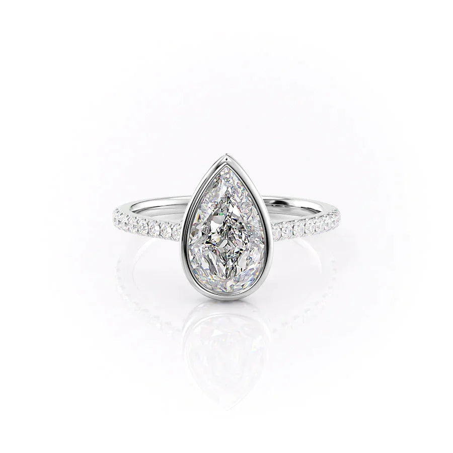 The Pave Charlotte. A White Gold Vintage, Hidden Halo, Bezel Engagement Ring Set With A 2ct Pear Lab Grown Diamond. White Background.