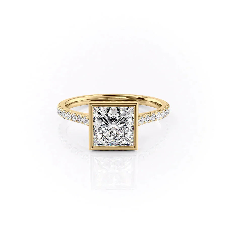 The Pave Charlotte. A Yellow Gold Vintage, Hidden Halo, Bezel Engagement Ring Set With A 2ct Princess Lab Grown Diamond. White Background.