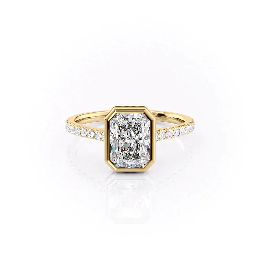 The Pave Charlotte. A Yellow Gold Vintage, Hidden Halo, Bezel Engagement Ring Set With A 2ct Radiant Lab Grown Diamond. White Background.