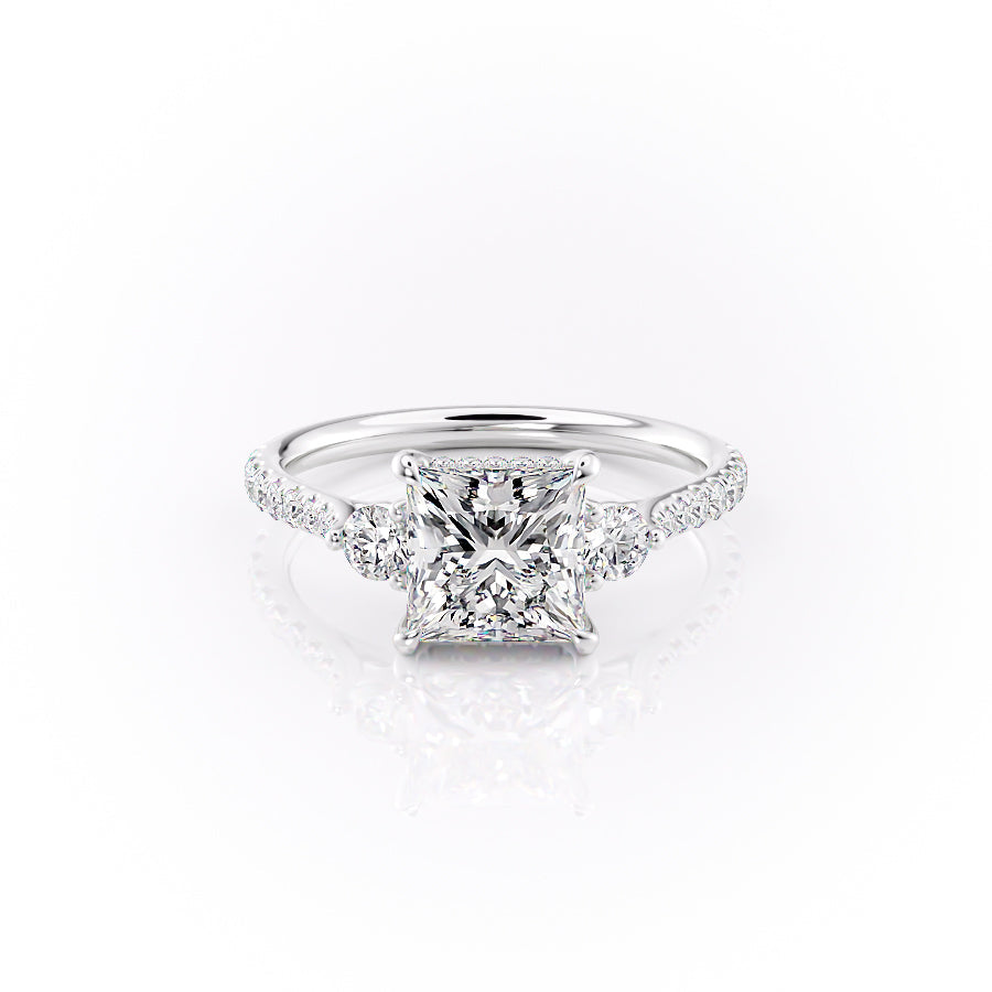 The Pave Lia. A White Gold Three Stone Engagement Ring Set With A 2ct Princess Lab Grown Diamond. White Background.