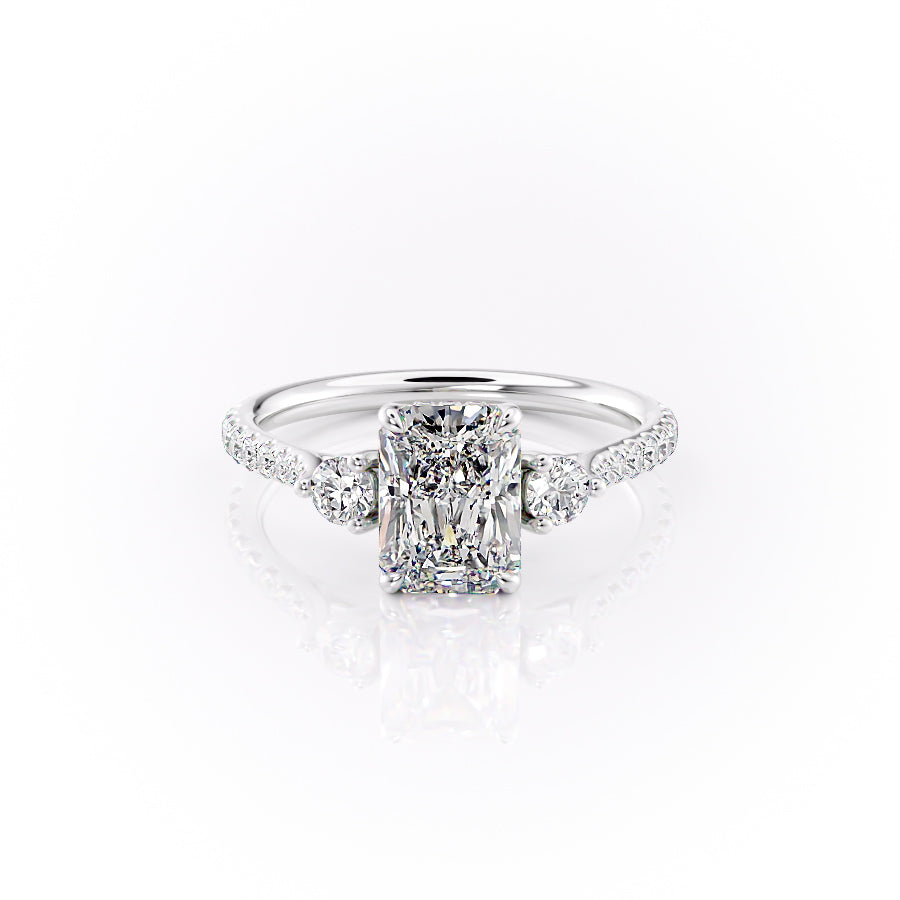 The Pave Lia. A White Gold Three Stone Engagement Ring Set With A 2ct Radiant Lab Grown Diamond. White Background.