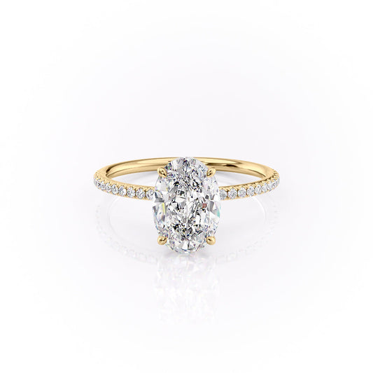 The Pave Lily. A Yellow Gold Nature Engagement Ring Set With A 2ct Oval Lab Grown Diamond. White Background.