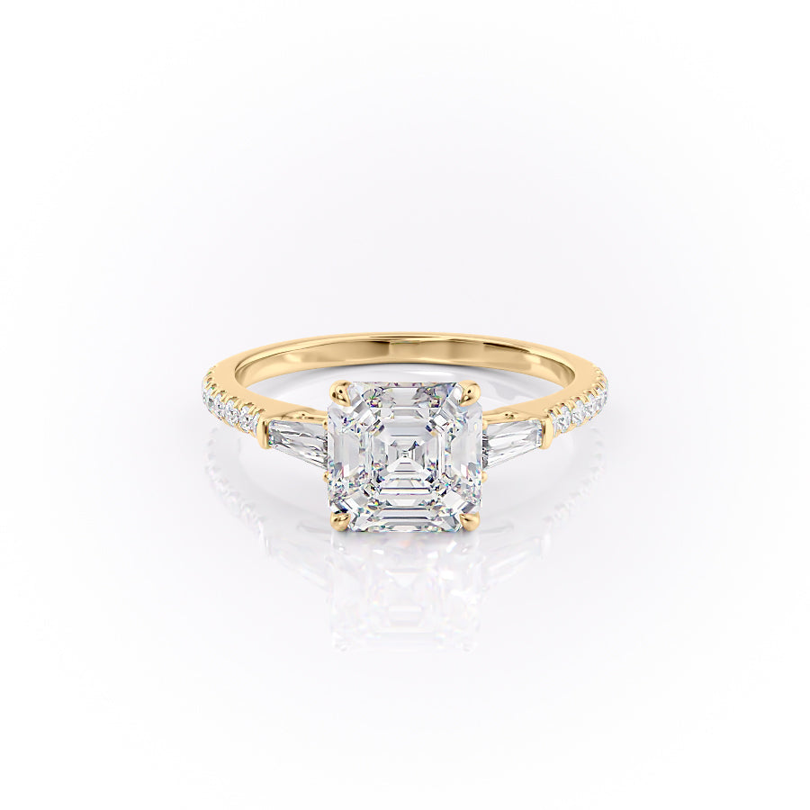 The Pave Liv. A Yellow Gold Three Stone Engagement Ring Set With A 2ct Asscher Lab Grown Diamond. White Background.
