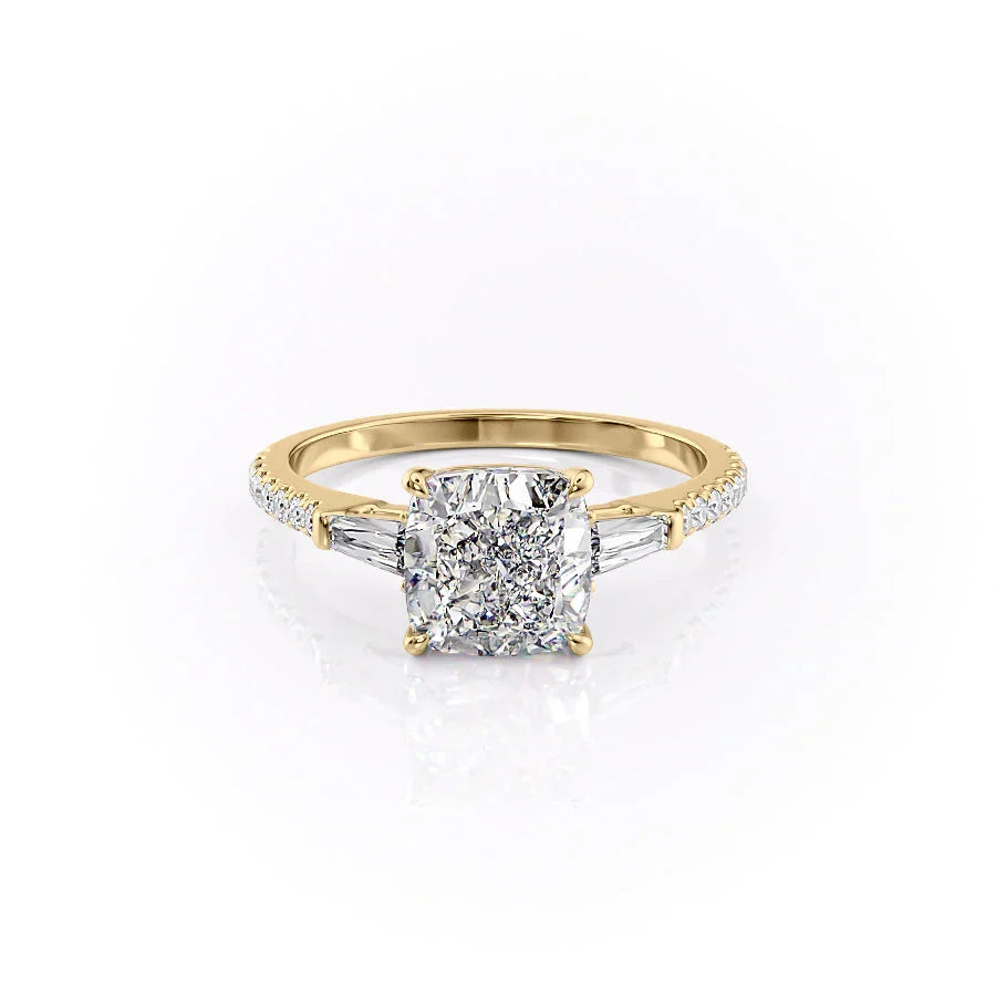 The Pave Liv. A Yellow Gold Three Stone Engagement Ring Set With A 2ct Cushion Lab Grown Diamond. White Background.