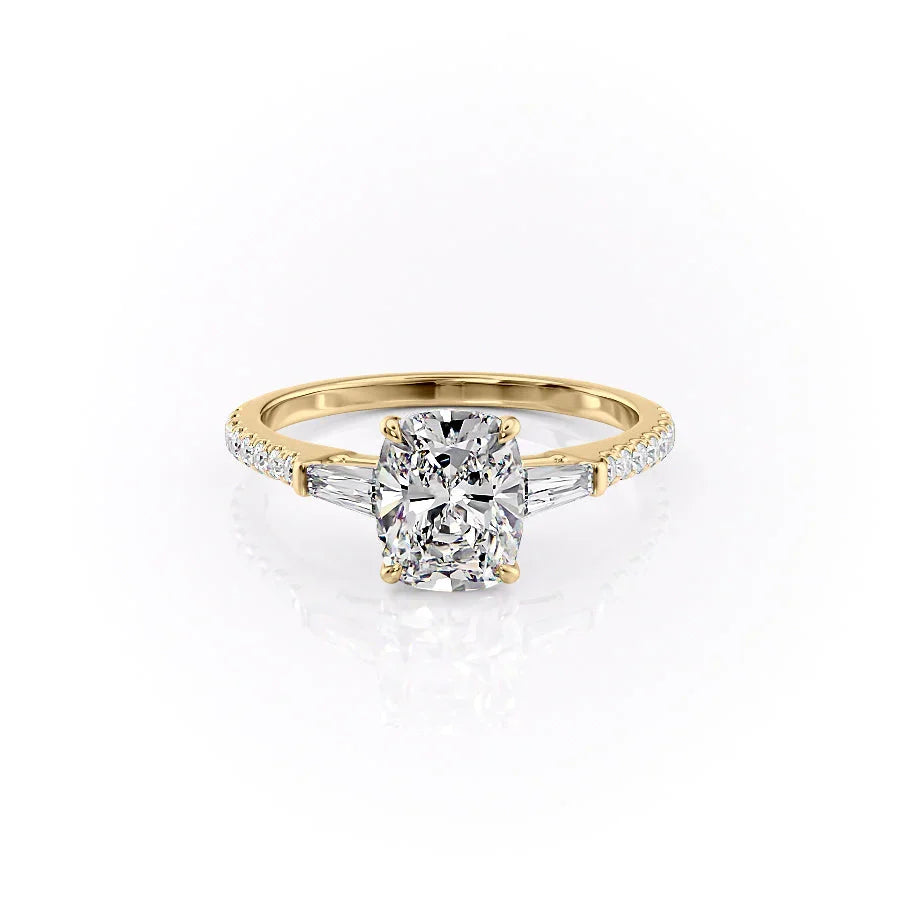 The Pave Liv. A Yellow Gold Three Stone Engagement Ring Set With A 2ct Elongated Cushion Lab Grown Diamond. White Background.