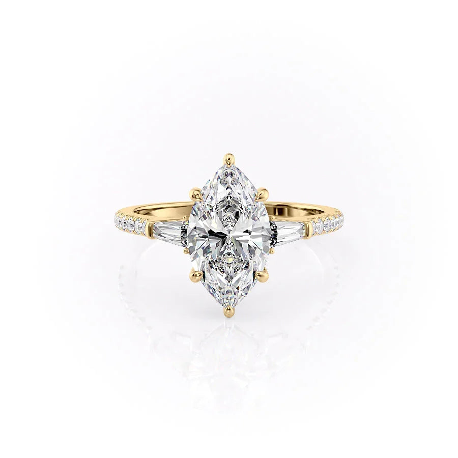 The Pave Liv. A Yellow Gold Three Stone Engagement Ring Set With A 2ct Marquise Lab Grown Diamond. White Background.