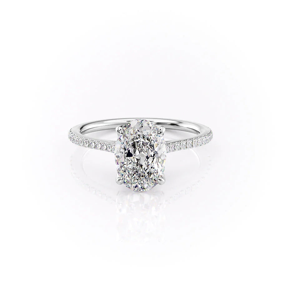 The Pave Madison. A White Gold Nature Engagement Ring Set With A 2ct Oval Lab Grown Diamond. White Background.