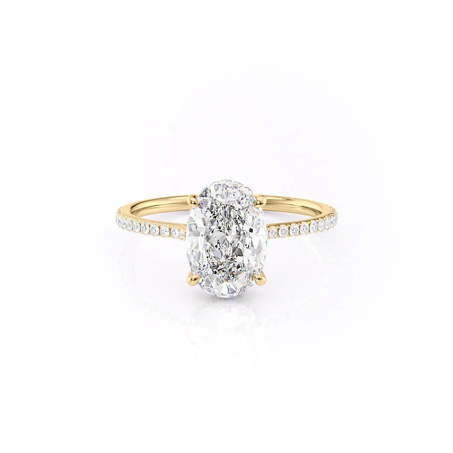 The Pave Maia. A Yellow Gold Hidden Halo Engagement Ring Set With A 2ct Oval Lab Grown Diamond. White Background.